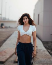 Desirable Sakshi Malik in a White Short Sleeved Crop Top with a Navy Blue Track Pants Photos 07