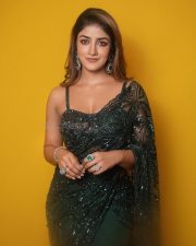 Dilmaar Heroine Dimple Hayathi in a Dark Green Saree with a Low Neck Sleeveless Blouse Photos 01