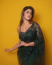 Dilmaar Heroine Dimple Hayathi in a Dark Green Saree with a Low Neck Sleeveless Blouse Photos 02