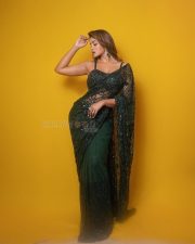 Dilmaar Heroine Dimple Hayathi in a Dark Green Saree with a Low Neck Sleeveless Blouse Photos 03
