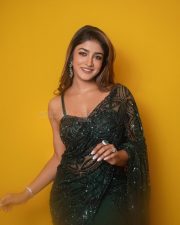 Dilmaar Heroine Dimple Hayathi in a Dark Green Saree with a Low Neck Sleeveless Blouse Photos 05