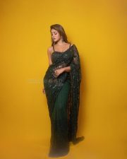 Dilmaar Heroine Dimple Hayathi in a Dark Green Saree with a Low Neck Sleeveless Blouse Photos 06