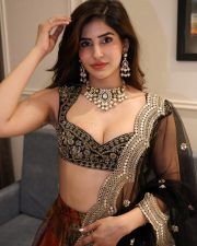 Dry Day Actress Sakshi Malik in a Black Embroidered Sweetheart Silk Blouse with a Brocade Collage Lehenga and Embellished Sheer Dupatta Photos 01