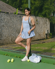 Eleven Actress Sakshi Malik in a Light Blue Halter Neck Sports Top And Pleated Mini Skirt Photos 01