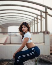 Fierce Sakshi Malik Midriff in a White Crossover Crop Top and Navy Track Pants Photos 03