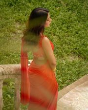 Glamorous Ruhi Singh in a Vibrant Coral Red Saree with a Matching Sleeveless Blouse Pictures 08
