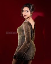 Luminous Actress Rittika Chakraborty in a Gold Metallic Backless Dress Photos 04