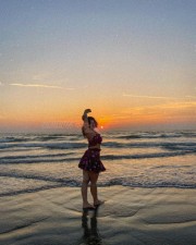 Ravishing Ketika Sharma in a Sleeveless Tube Top and Mini Skirt at the Beach Photos 03