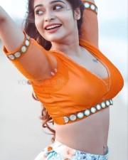 Sexy Dharsha Gupta in a Colorful Skirt and Orange Blouse Photos 02
