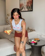 Sexy Hot Babe Sakshi Malik in a White Crop Top and Brown Mini Shorts for Holi Photos 01