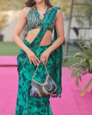 Sexy Model Sakshi Malik in a Green Printed Saree with a Sleeveless Blouse Pictures 03