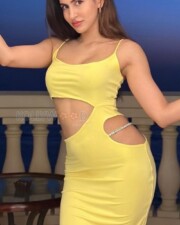 Sexy Sakshi Malik in a Lime Strappy Multi Waist Cut Out Midi Dress Photos 01