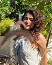 Sizzling Ketika Sharma in a Cream Colored Halter Neck Crop Top with a Blue Mini Skirt Photos 01