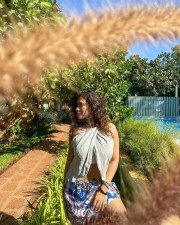 Sizzling Ketika Sharma in a Cream Colored Halter Neck Crop Top with a Blue Mini Skirt Photos 05