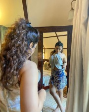 Sizzling Ketika Sharma in a Cream Colored Halter Neck Crop Top with a Blue Mini Skirt Photos 09