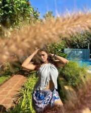 Sizzling Ketika Sharma in a Cream Colored Halter Neck Crop Top with a Blue Mini Skirt Photos 10