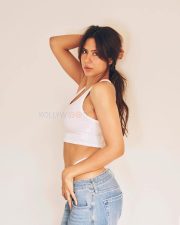 Steamy Hot Sonam Bajwa in a White Ribbed Tank Top with a Light Denim Jeans Pictures 05