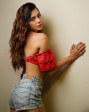 Tempting Ruhi Singh in a Red Off Shoulder Crop Top with a Light Wash Denim Shorts Photos 02