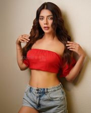 Tempting Ruhi Singh in a Red Off Shoulder Crop Top with a Light Wash Denim Shorts Photos 03