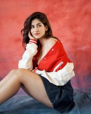Trendsetting Sakshi Malik Cleavage in a Red Varsity Jacket with Denim Mini Skirt Photos 01