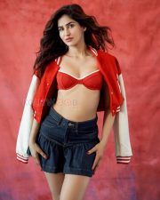Trendsetting Sakshi Malik Cleavage in a Red Varsity Jacket with Denim Mini Skirt Photos 04