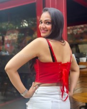 Actress Ashwini Sri in a Mini Red Top and White Shorts Photos 03