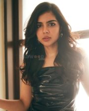 Elegant Chic Beauty Kalyani Priyadarshan in a Black Leather Top with White Pants Photos 03