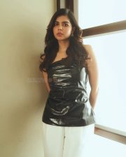 Elegant Chic Beauty Kalyani Priyadarshan in a Black Leather Top with White Pants Photos 08