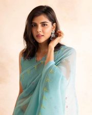 Enchanting Kalyani Priyadarshan in a Blue Organza Saree Photos 01