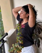 Actress Poonam Bajwa in Black T Shirt and White Mini Shorts Photos 04