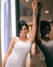 Glamorous Actress Sanam Shetty in a White Textured Bodycon Midi Dress Photos 01