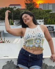 Glowing Actress Poonam Bajwa in a White Crochet Crop Top and Denim Shorts Photos 04