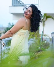 Radiant Actress Poonam Bajwa in a Pale Yellow Spaghetti Strap Dress Photos 02