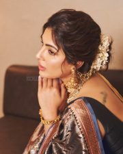 Actress Samyuktha Menon in a Dark Traditional Handloom Silk Saree with a Simple Sleeveless Black Blouse Pictures 04