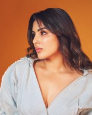 Actress Samyuktha Menon in a Light Wash Denim Shirt with a Deep V Neckline with a Matching Skirt Pictures 01