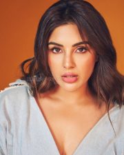 Actress Samyuktha Menon in a Light Wash Denim Shirt with a Deep V Neckline with a Matching Skirt Pictures 04