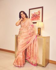 Actress Samyuktha Menon in a Nude Pink Tissue Saree with a Champagne Toned Blouse Photos 01