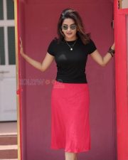 Engaging Actress Mahima Nambiar in a Black T Shirt with Red Pants Photos 02