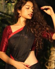 Sexy and Stunning Varsha Bollamma in a Black Saree with a Red Blouse Photos 04