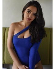 Sizzling Ahsaas Channa in a Blue One Piece On the Bed Photoshoot Pictures 01