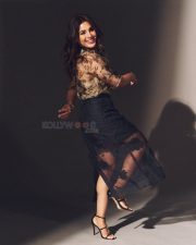 Slum Dog 33 Temple Road Actress Samyuktha Menon in a Sheer High Neck Multi Colored Floral Printed Top with a Black High Waisted Skirt Photos 03