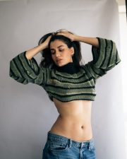 Stylish Actress Shreya Dhanwanthary in a Green Striped Crop Sweater Photos 01