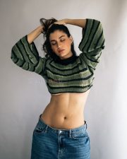 Stylish Actress Shreya Dhanwanthary in a Green Striped Crop Sweater Photos 04
