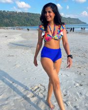 Vibrant Actress Shreya Dhanwanthary in a colorful floral top and blue shorts Photos 04