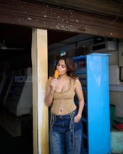 Winsome Actress Shreya Dhanwanthary in a Tan Lace Up Corset Top and Wide Leg Blue Jeans Photos 03