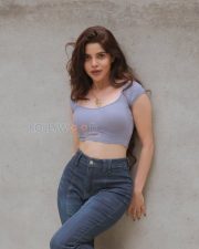 Charming Actress Divya Bharathi in a Lavender Ribbed Crop Top and Blue Jeans Photos 02