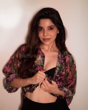 Charming Divya Bharathi in a Floral Printed Sheer Top over a Black Bralette and a Black Skirt Pictures 01