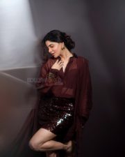 Glamorous Divya Bharathi in a Maroon Two Piece Outfit with a Button Down Shirt and Sequin Mini Skirt Photos 06