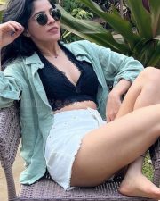 Hottie Divya Bharathi in a Black Bralette and White Mini Shorts with a Pale Green Shirt Photos 04