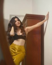 Magnetic Actress Divya Bharathi in a Black Crop Top And Mustard Satin Skirt Photos 02